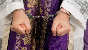 Handcuffs-on-priest-via-Shutterstock-800x430
