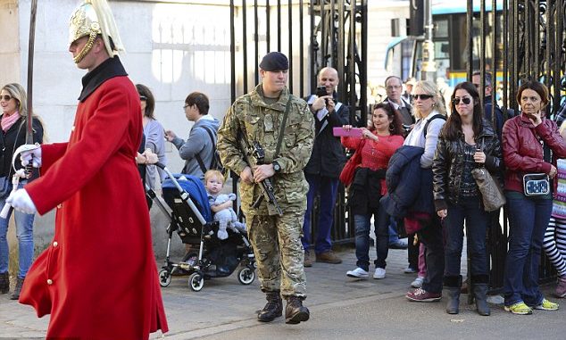 Armed guards seen on the streets of Westminster as military boosts security in the wake of Canadian parliament attack