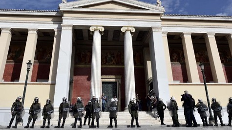 Greek riot police and protesters clash in Athens