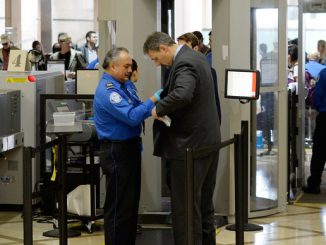 US steps up airport, federal building security after Paris attacks