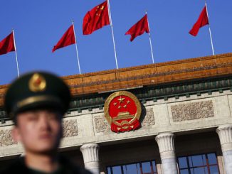 China warns Japan to remain pacifist as Tokyo eyes military return