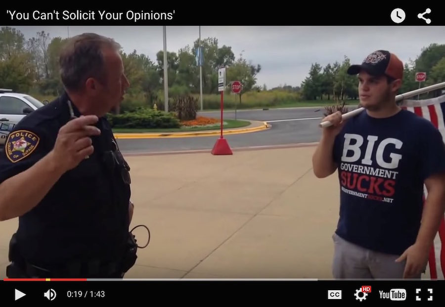 Video of a cop threatening college students with jail for the 'crime' of distributing constitutions