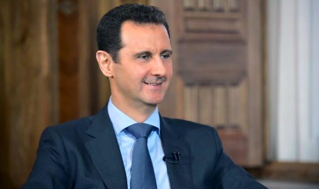 Syria's President Bashar al-Assad answers questions during an interview with al-Manar's journalist Amro Nassef, in Damascus