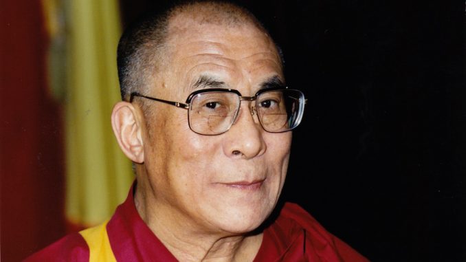 The Dalai Lama has urged the world to "stop praying for Paris"