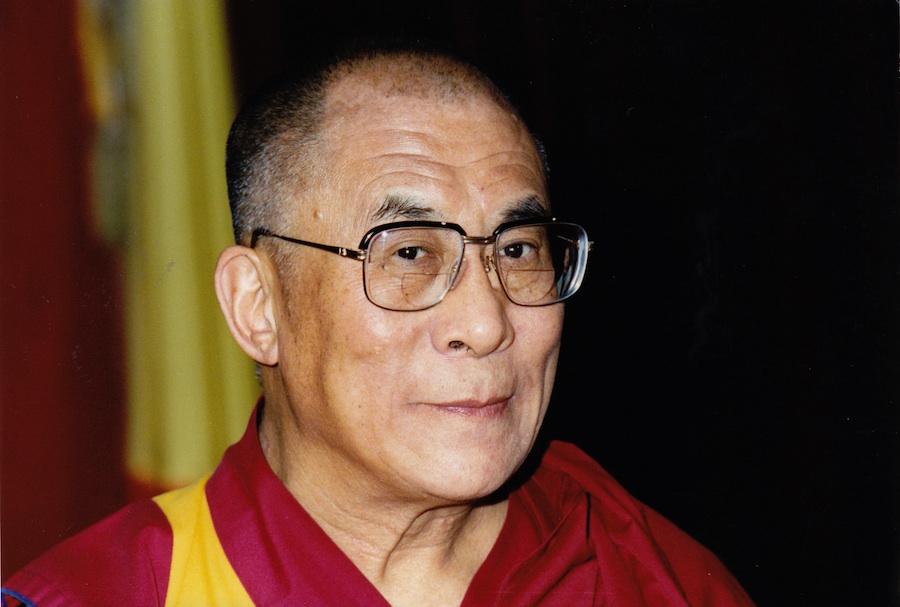 The Dalai Lama has urged the world to "stop praying for Paris"