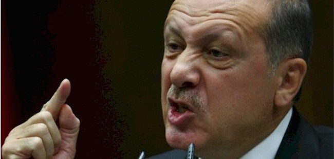 Turkish President Erdogan silences a journalist during a press conference when asked about Turkey's support of ISIS