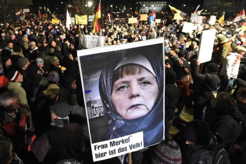 Hundreds of Germans call for Angela Merkel to be prosecuted for treason