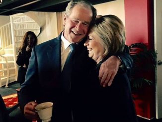 Theater of politics encapsulated in a photograph as Hillary Clinton and George W. Bush embrace at Nancy Reagan's funeral service