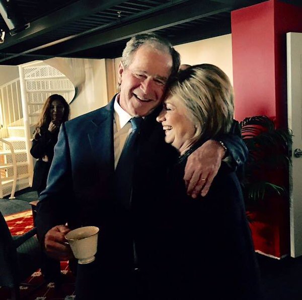Theater of politics encapsulated in a photograph as Hillary Clinton and George W. Bush embrace at Nancy Reagan's funeral service