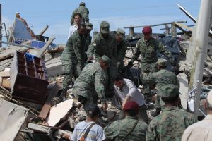 Inhabitants and army forces look for survivors after a 7.8 magnitude earthquake hit the Ecuadorian northern coastal region, in the town of Pedernales, Ecuador, 17 April 2016. At least 233 people were killed and hundreds injured in an earthquake affecting the Ecuadorian northern coastal region. EPA/JOSE JACOME