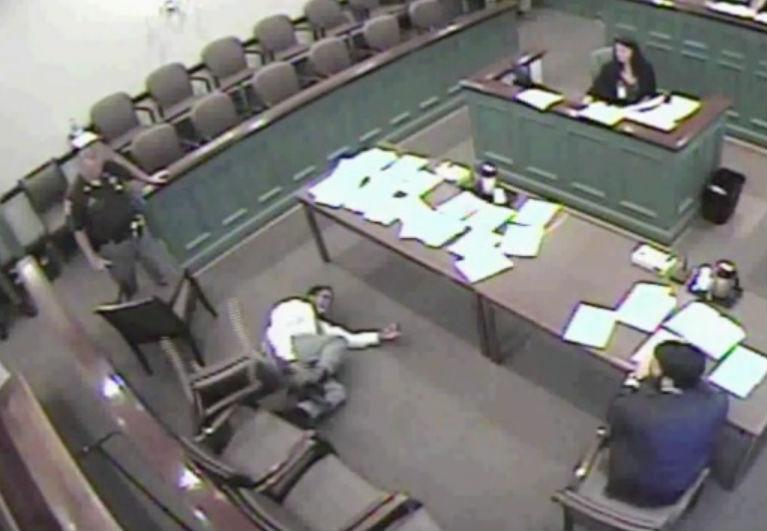 Sadistic judge orders cop to electrocute helpless man in courtroom