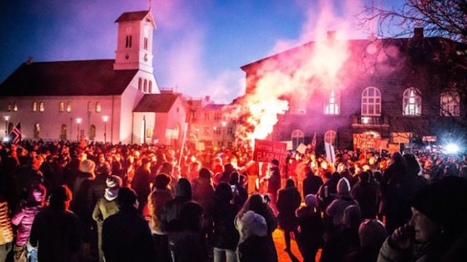 Thousands of protestors take to the streets of Iceland in record-breaking numbers, demanding snap elections