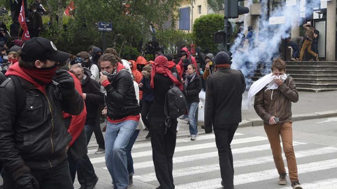 Riot Police Clash With Protesters In France