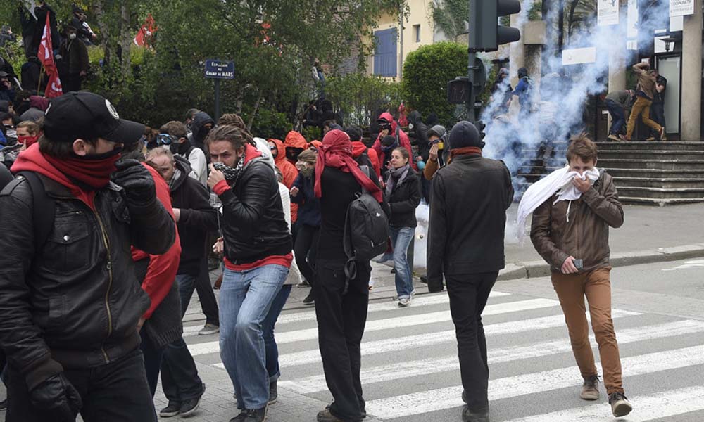 Riot Police Clash With Protesters In France