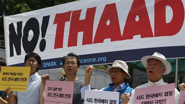 South Korean protesters shout slogans during a rally to denounce deploying the US THAAD missile defense system in Seoul on July 8, 2016. ©AP
