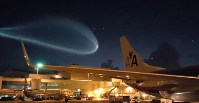 Airports workers in Miami were left stunned when a giant UFO floated above them, lighting up the night sky.