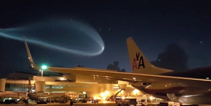 Airports workers in Miami were left stunned when a giant UFO floated above them, lighting up the night sky.