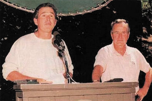 Former President George W. Bush and his father attending Bohemian Grove