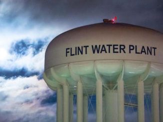 Six more state officials have been charged in connection with the Flint water crisis, as Governor Rick Snyder continues to evade responsibility for the disaster.