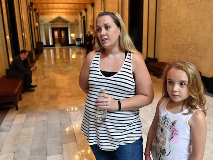 Nicole Nichols, like other struggling parents, is having a hard time coming up with the more than $2,000 a month needed to keep her 8-year-old daughter, Bella, healthy.