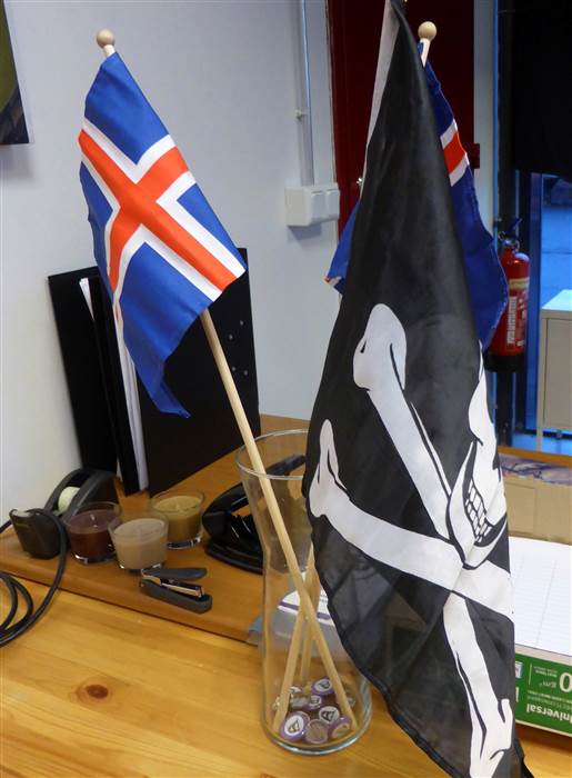 The Pirate Party flag next to the Jolly Roger.