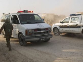 Israeli Prime Minister Benjamin Netanyahu, third right, visits a militant wounded in Syria at a field hospital in northern Israel, February 2014.