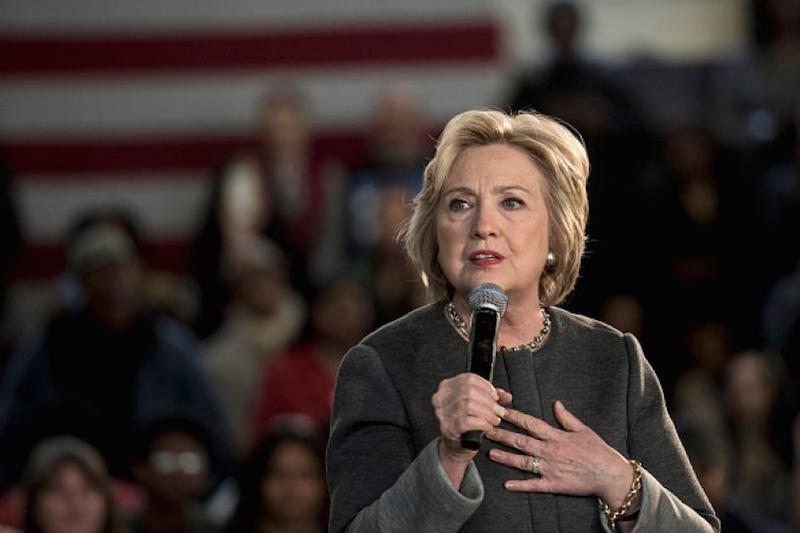 A scheduled speaker at a Hillary Clinton rally went off-script and began listing reasons why the audience shouldn't vote for her - until he was physically removed from the stage!