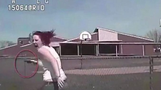 US cop filmed running over woman in his car