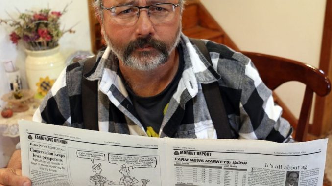 Monsanto forced an Iowa newspaper to fire a cartoonist after he dared to criticize the salary of their CEO.