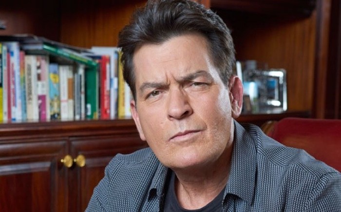 Charlie Sheen has opened fire on Big Pharma, pointing out that the government owns the patent to "the cure for AIDS" but is "covering it up.”