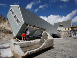 An MIT economics professor warns that mortgage defaults resulting from hurricane damage will send the world into another global recession.
