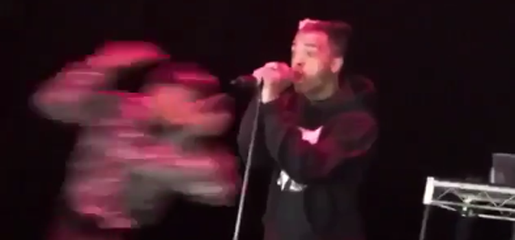 The rapper who released a video featuring the lynching of a white toddler wasn't able to do much when confronted by an angry vigilante live on stage.