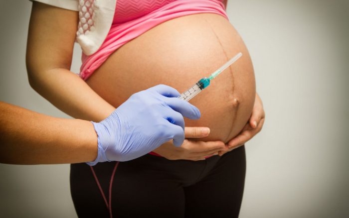Merck pay pregnant mothers to accept experimental vaccine that could induce abortion as side-effect