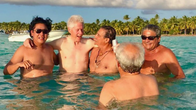 Robert Mueller's star witness in Trump Russia probe caught partying with Bill Clinton