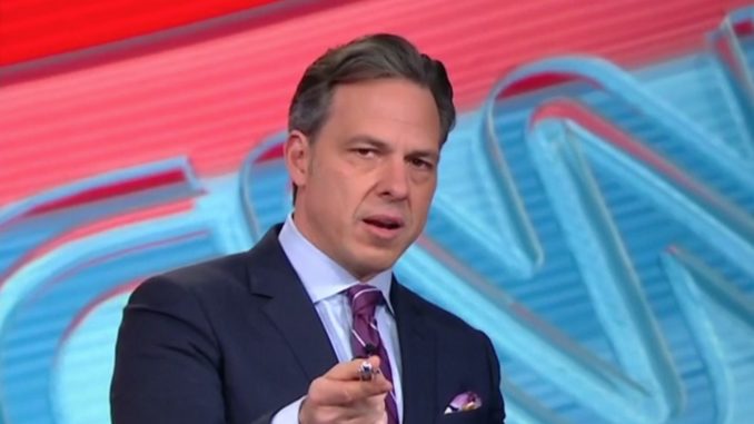 CNN reporter Jake Tapper has been implicated in a political espionage scandal after a House Report linked him to a DNI leak.