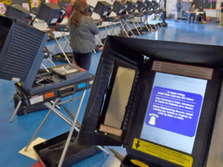 Remote-access software was installed in some U.S. voting machines by a top vendor, leaving them vulnerable to hackers, Congress has learned.
