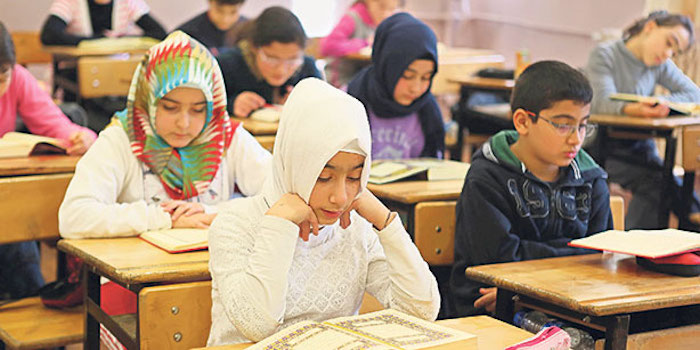 A German school headmaster in Frankfurt-am-Main told the mother of a student she should dress her daughter in a hijab, or Muslim head covering, so that Muslim students would stop bullying the girl.