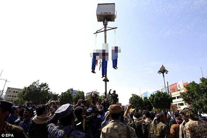 Three pedophiles were publicly executed and hanged from cranes after they were found guilty of brutally raping and killing a 10-year-old boy.