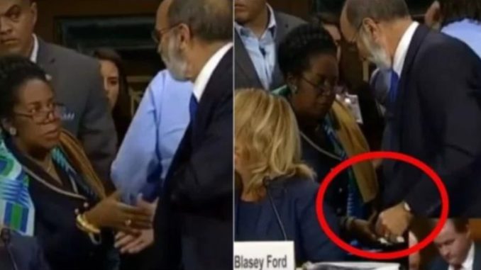 Democrat rep caught slipping mysterious envelope to Dr. Ford's lawyers