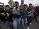 Mexican Police were fired upon by two armed Honduran migrants this week as they attempted to provide security for the notoriously unsafe caravan. 