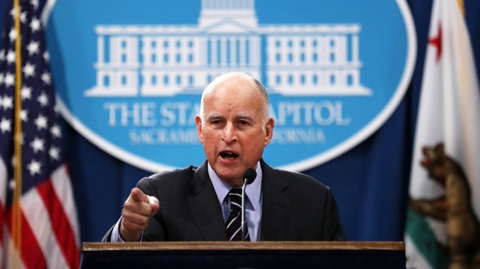Gov. Jerry Brown says global warming is to blame for California wildfires spreading through the state