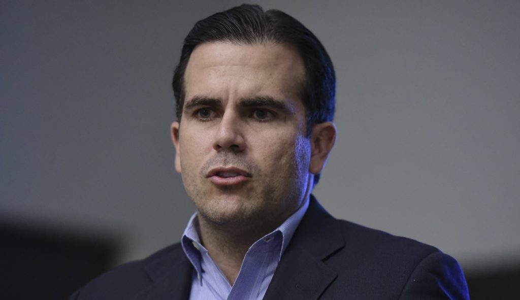 Puerto Rico's governor issued a threat to President Trump during a CNN interview Thursday, vowing to punch him in the mouth.