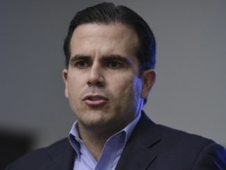Puerto Rico's governor issued a threat to President Trump during a CNN interview Thursday, vowing to punch him in the mouth.