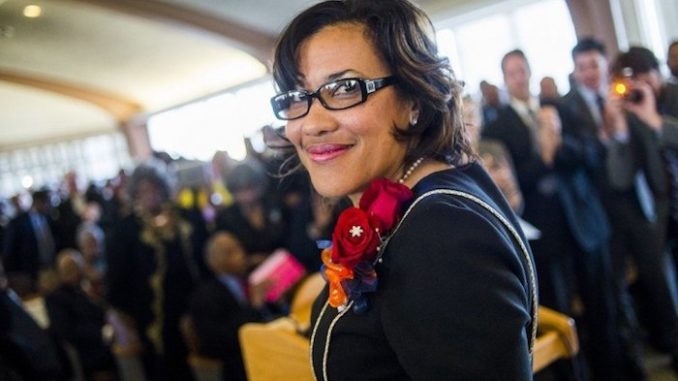 Flint's Mayor Karen Weaver has been accused of using the water crisis for personal gain by re-directing donations to a political fund.