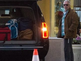Authorities found a foreign passport with Jeffrey Epstein's photo and a false name in a "locked safe" during a search of his New York home.
