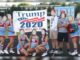 High school cheerleaders at a North Carolina school have been put on probation after posing with a Trump 2020 banner.