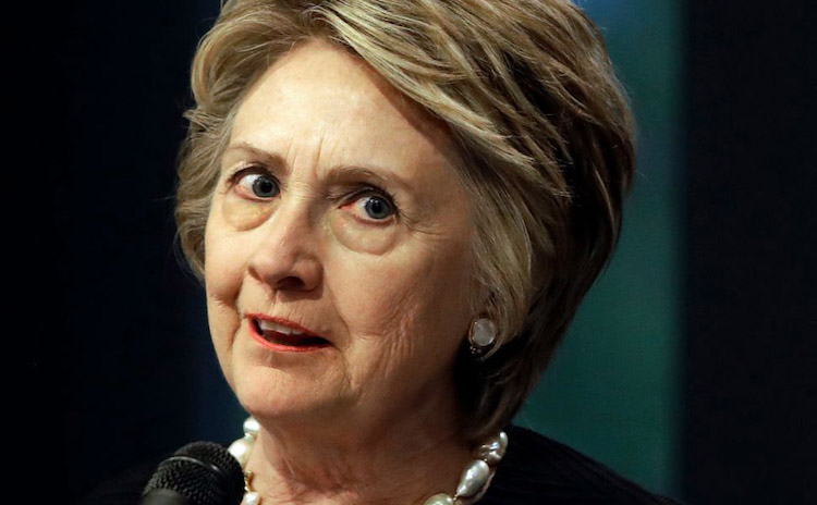 Hillary Clinton used Twitter to claim Trump is responsible for "sickening horror" in Syria and many users criticized her own history.