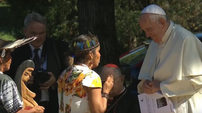 Pope Francis hosted a global warming themed event that included dozens of people literally bowing down before a carved pagan idol inside the Vatican walls.