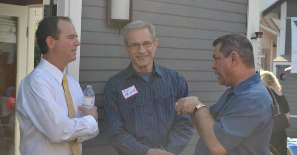 Rep. Adam Schiff and Ed Buck (center) outside a house in California.