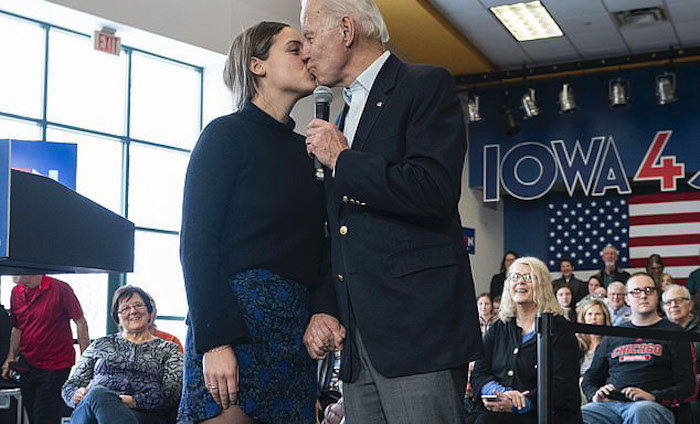 Creepy Joe Biden gave his teenage granddaughter a kiss on the lips while clutching her hand as a crowd of Democrats watched at a campaign event ahead of the upcoming Iowa caucuses.